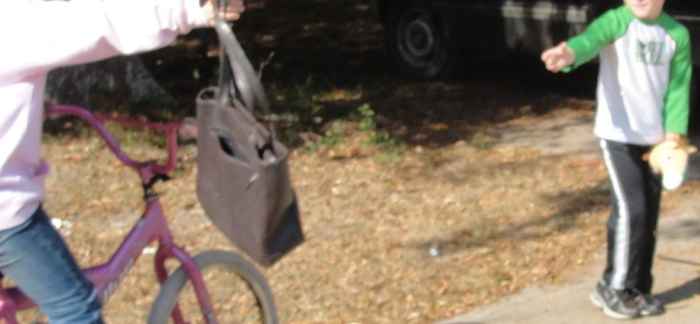 Passing along the mochila while reenacting the Pony Express