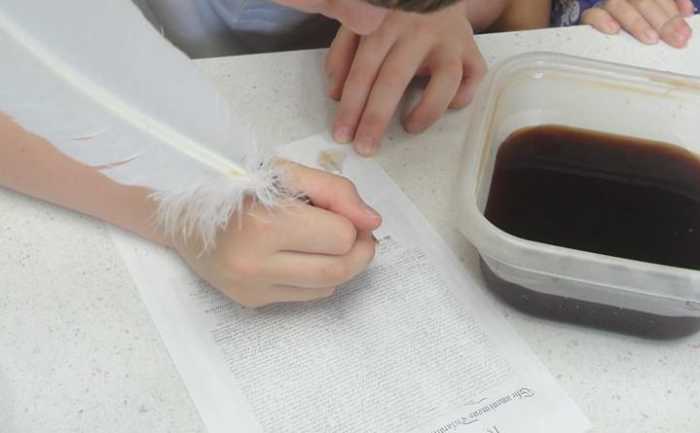 Signing the Declaration of Independence with a quill pen and homemade ink