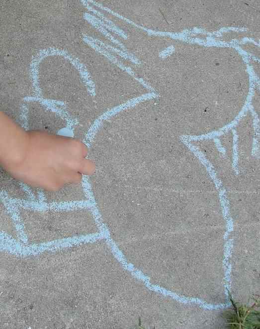 Pueblo-style chalk drawing using sidewalk chalk