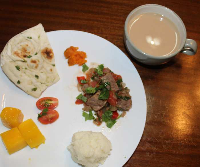 Our Kenyan Meal the second time we made it - We added a small spoonful of sweet potato as well. Our "tomato salad" was smaller because most of my children do not like fresh tomatoes.