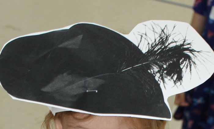 "Caviler" hat printed and stapled to a paper headband