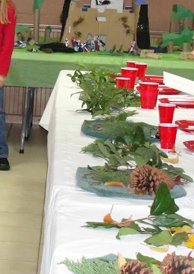 Tables set in a U shape with greenery decorations