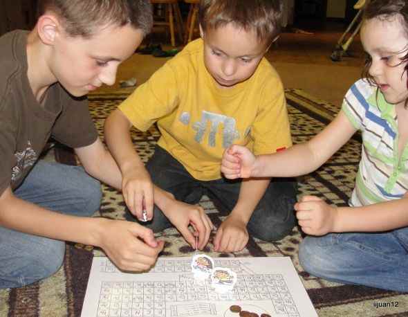 Playing the Periodic Table of Elements Board Game, which is one of the many fun activities from Ellen McHenry's Elements Chemistry Unit