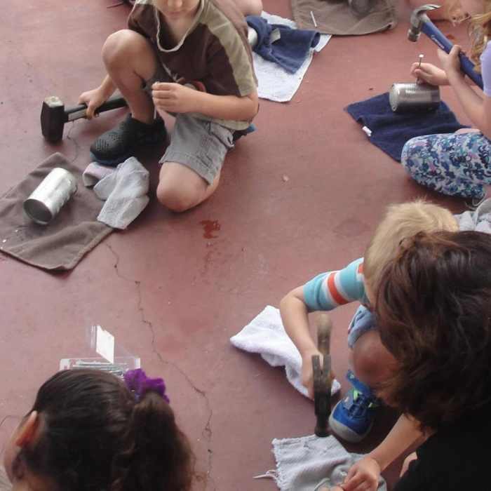 Making tin can lanterns